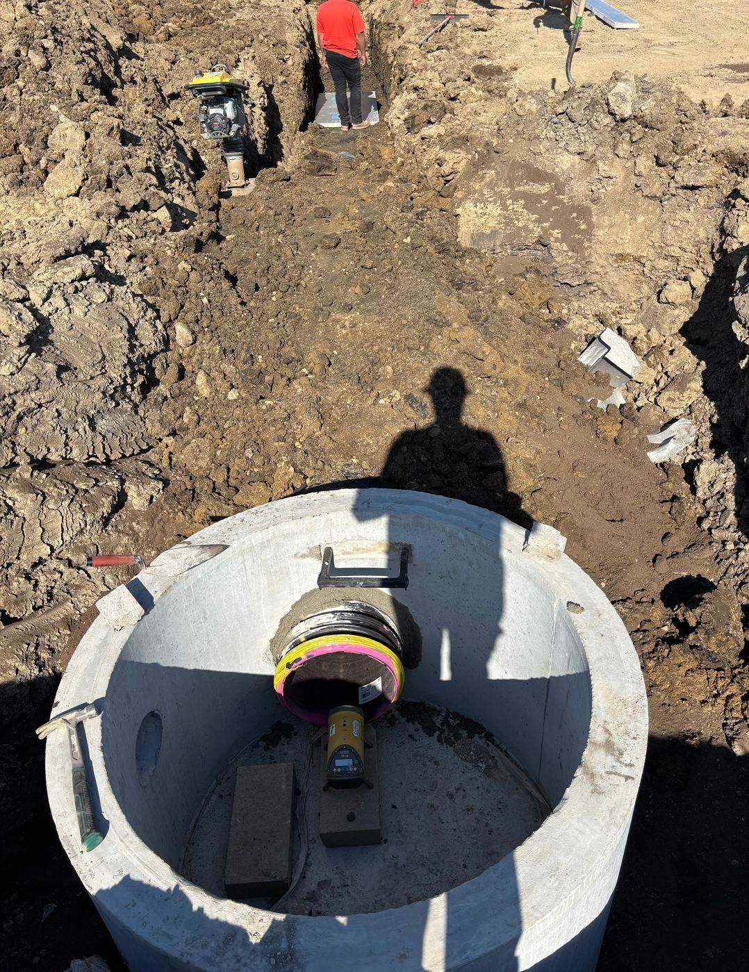 New sanitary manhole structure being cored and connected