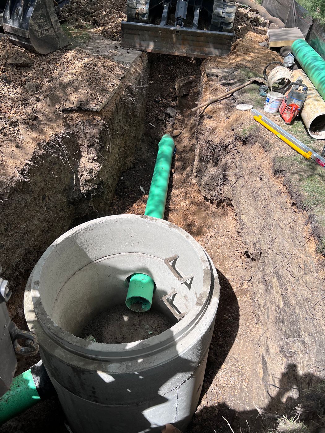 Storm structure with green HDPE pipe connections